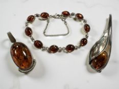 A group of silver and amber jewellery