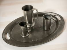 An Arts and Crafts hammered pewter twin handled oval platter stamped Puritan Pewter,