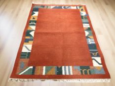 An Eastern fringed woolen rug,