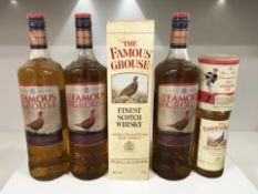 Three 1 litre bottles of Famous Grouse whisky,