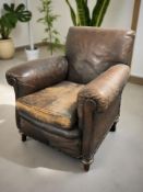 An Art Deco brown leather club armchair,