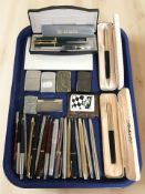 A collection of fountain and ballpoint pens including Parker, Sheaffer,