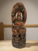 A Chinese carved hardwood statue of Guanyin,