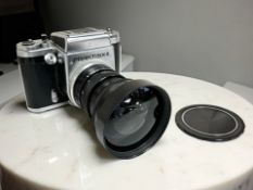 An East German Praktisix-II medium format 6x6 film camera, with MIR-3B 3,5/65 wide angle lens.