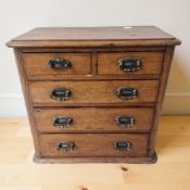 A Victorian walnut five drawer apprentice chest, width 35 cm.