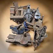 A group of vintage cast iron vices