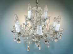 A two-tier eight branch crystal chandelier, diameter 52 cm.