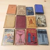 A small group of antiquarian volumes including Susan Strong, Louisa Alcott, May Wynne, etc.