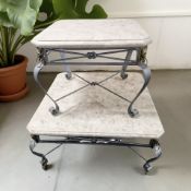 Two graduated travertine topped metal coffee tables, largest 92 cm wide.