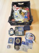 A collection of embroidered insignia, various medals, lapel badges, etc.