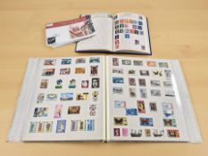 An album of British mint stamps, further loose stamps with cancellation marks,