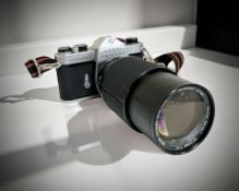 An Asahi Pentax Spotmatic 35mm film camera with Vivitar Series 1 70-210mm 1:3.5 lens.