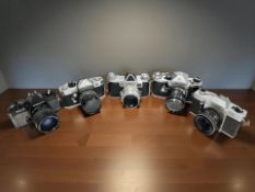 A collection of 35mm film cameras to include Praktina FX, Hanimex Topcon RE Auto,