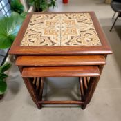 A G Plan teak tile inset nest of three tables, width 50 cm.