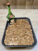 A Benedictine glass bottle and a large quantity of Elizabeth II pennies.