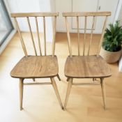 A pair of Ercol Model 391 elm and beech spindle back chairs.