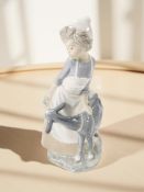 A Nao figure group of a girl and a goat, height 30 cm.