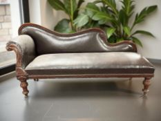 A Victorian mahogany framed chaise longue in studded faux leather upholstery, length 183 cm.