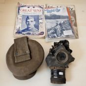 A military gas mask, together with a cap labelled 'J Collett Limited, London',