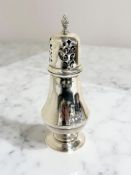 A silver sugar caster, Birmingham 1990, height 15.