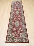 A machine-made runner of Iranian design,