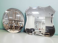Five un-framed mirrors including a circular example,