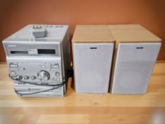 A Sony CMT-CP300 micro hi-fi, with remote and a pair of speakers.