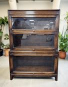 An Angus glazed oak three height stacking bookcase, 88 cm W x 32 cm D x 127 cm H.