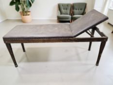 An Edwardian physician's examination table, labelled 'Edwards Surgical Supplies Limited, London',