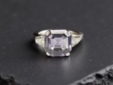 An 18ct white gold synthetic sapphire and diamond ring, set with diamond shoulders, size N.