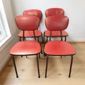 A set of four metal framed vinyl cafe chairs.