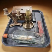 Three antique cutthroat razors, a ship in bottle, a Mason candle lamp,