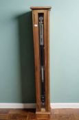 A teak cased barometer, height 118 cm.