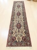 A machine-made runner of Iranian design,