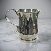 A silver mug, Horace Woodward & Co Ltd, London 1912, height 10 cm.