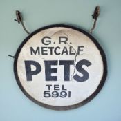 A G. R. Metcalf double-sided pet shop hanging street sign, diameter 46 cm.