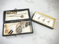 A pearl stick pin stamped 9ct, another Victorian diamond-set stick pin stamped 15ct,