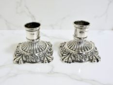 A pair of loaded-silver dwarf candlesticks, Birmingham 1911, height 3.