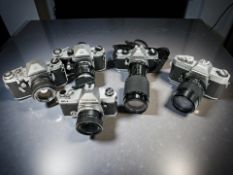A collection of 35mm film cameras to include Topcon examples,