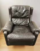 A 20th century Danish black leather wing back armchair in the style of Gimson & Slater,