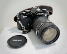 A Nikon FM2 35mm film camera with Nikon AF Nikkor 35-70mm 1:2.8 lens.