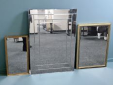 A bevelled frameless mirror, 105 cm x 74 cm, and two gilt framed mirrors.