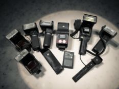 A collection of vintage flash guns / accessories to include two Hanimex Pro 550 examples,