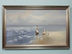 John Horsewell (British, born 1952-) A woman, girl and dog at the sea shore, oil on board,