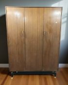 A G-plan teak triple door wardrobe designed by E Gomme,