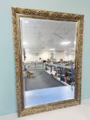 A reproduction gilt and bevelled mirror, 86 cm x 61 cm.