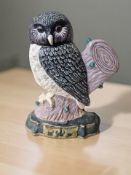 A painted cast iron doorstop in the form of an owl, height 32 cm.