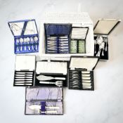 A hamper containing several canteens of EPNS and stainless steel cutlery