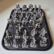 A collection of pewter fantasy figurines.