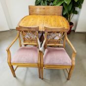A reproduction yew wood extending dining table with leaf,